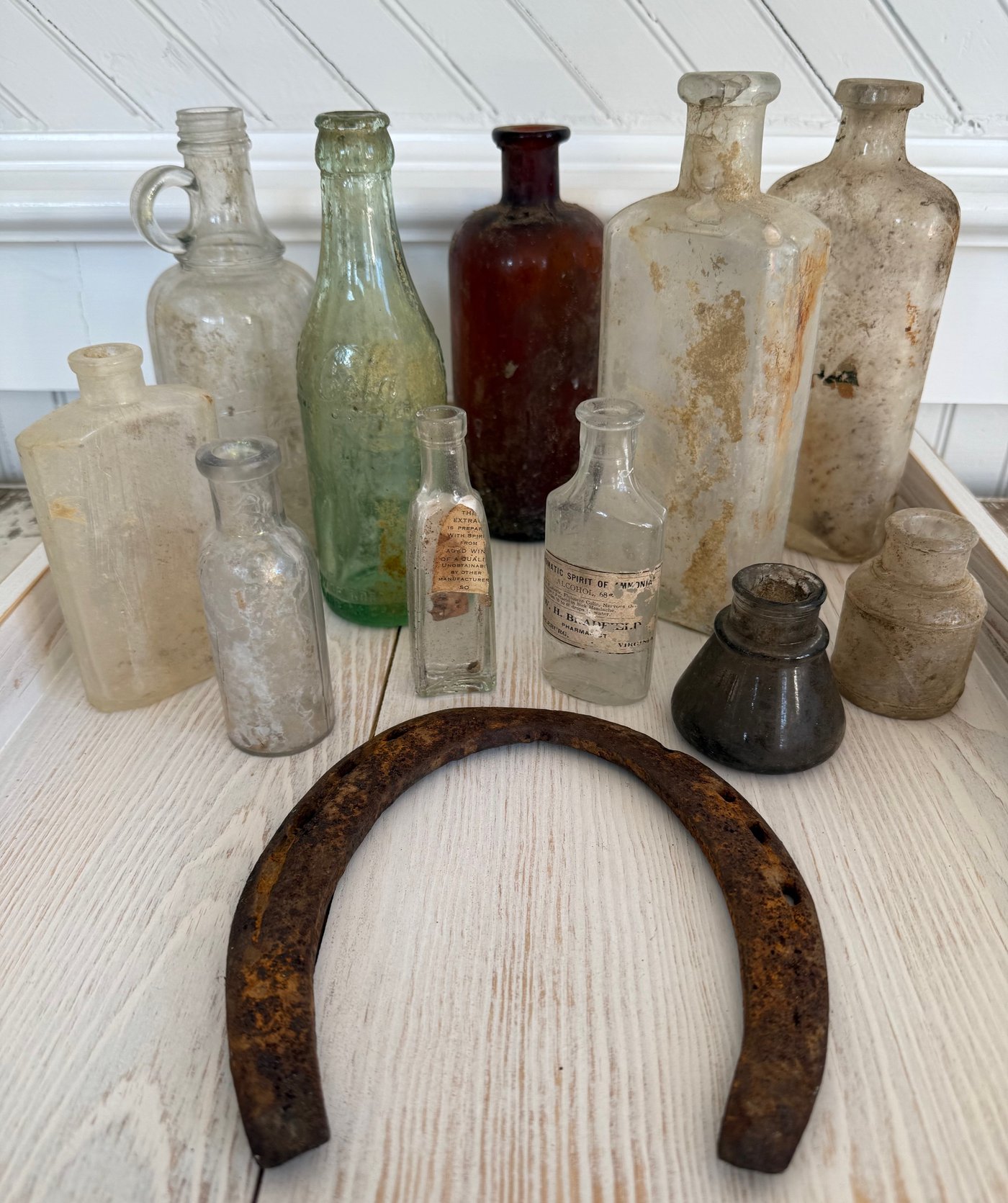 Bottles and horseshoe salvaged from the schoolhouse grounds